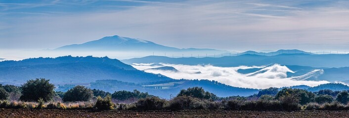 the mountains of the valley with fog