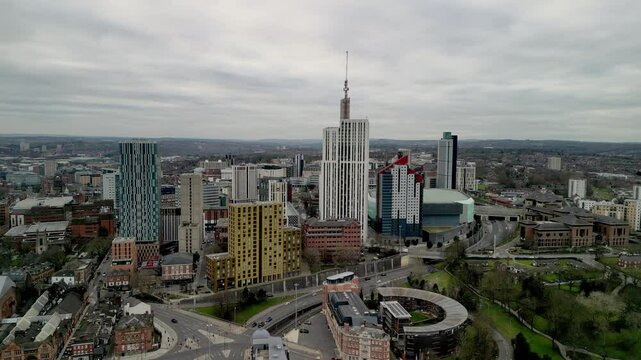 Skyscrapers in Leeds city centre, with the camera slowly moving to the right. High-quality drone footage.