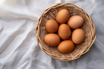 chicken egg in wood basket