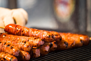 skewers of golden and tempting grilled sausages are neatly arranged