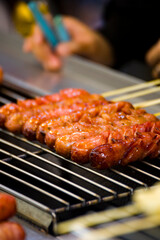 skewers of golden and tempting grilled sausages are neatly arranged