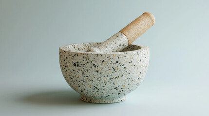 stylish mortar and pestle set made of speckled stone with wooden handle