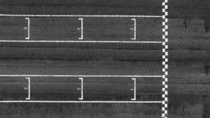 Fototapete Formel 1 Start or finish line on car race, Start and finish line racing, Grid start race track, Top view textured and background grid start on the asphalt road race track abstract.  © Kalyakan