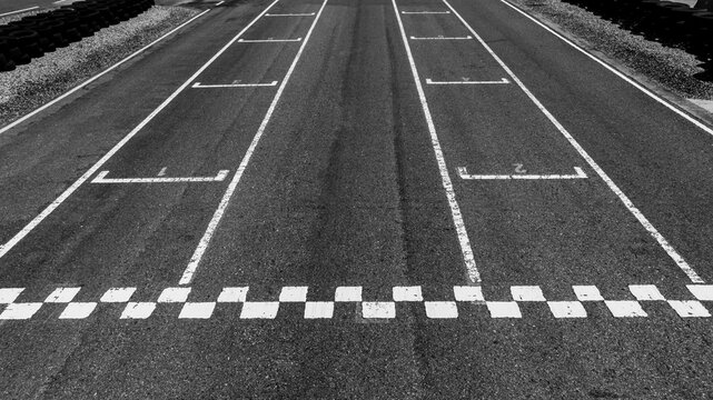 Start or finish line on car race, Start and finish line racing, Grid start race track, Top view textured and background grid start on the asphalt road race track abstract.