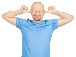 Man covering ears and closing eyes trying to ignore noise