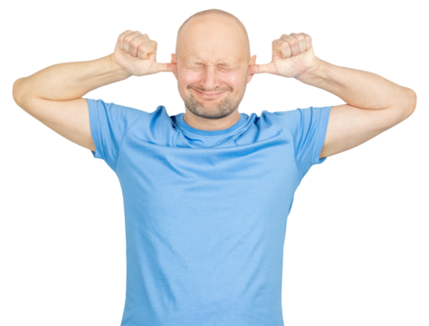 Man covering ears and closing eyes trying to ignore noise