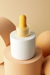 Stylish presentation of skin care product on beige background