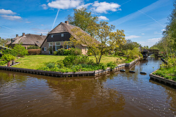 Giethoorn Netherlands, city skyline at canal and traditional house in Giethoorn village