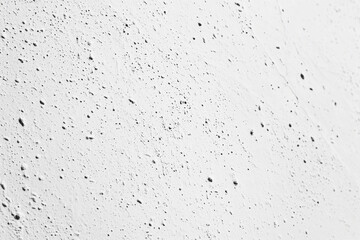 Fototapeta premium Minimalist Concrete Wall Texture in Off-White with Speckled Pattern for Tranquil Backgrounds and Abstract Art