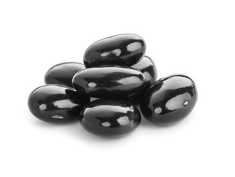 Black jelly beans pile on white