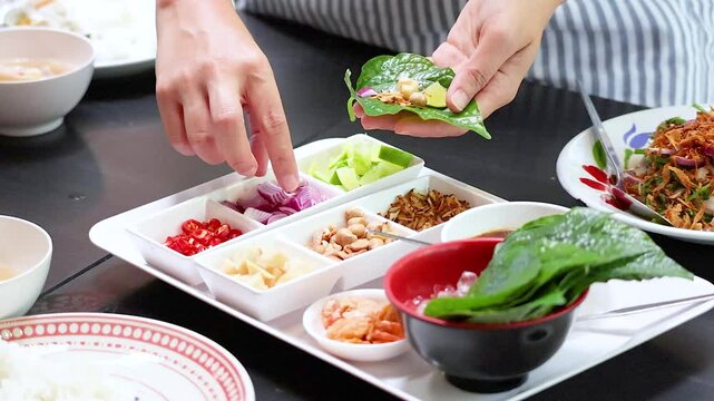 Preparing Miang Kham Savoury Leaf Wraps