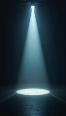 Dramatic spotlight illuminating a circle on dark stage floor