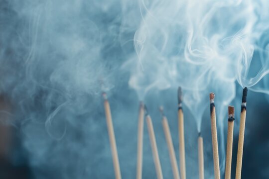 cinematic close-up of incense sticks burning in temple with smoke swirling gracefully in soft lighting