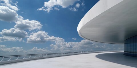A captivating shot of modern architectural curves against a bright blue sky, showcasing design excellence and the harmony between nature and human creativity.