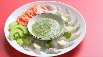 shrimp in fish sauce with Thai spicy seafood dipping sauce on white plate