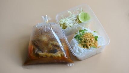 rice vermicelli with northern thai curry sauce in plastic bag