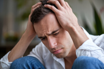 Man with head in hands