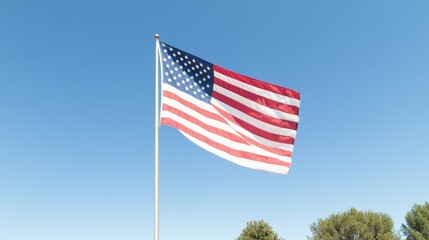 american flag waves gently in breeze prominently displayed against clear blue sky its vibrant reds whites and blues