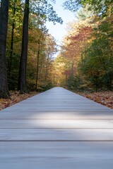 capture wide-angle shot of empty wooden boardwalk stretching into vibrant autumnal forest where golden orange and red