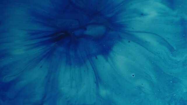 Wet acrylic. Paint emulsion. Art blue blobs spill on surface. Liquid dye leak spread abstract background decorative swirl splatter.