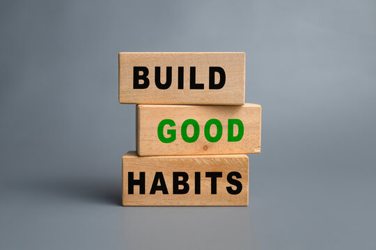 build good habits words symbol on wooden blocks isolated on grey background. motivational words concept