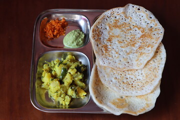 Set Dosa, soft, light and spongy dosa, served with potato subji, coconut green chutney and peanut dry chutney, south Indian food