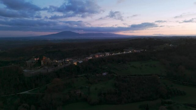 Aerial view of Celleno comune in the province of Viterbo at twilight with Mount Amiata in the background