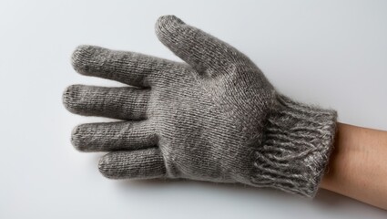 Wool glove displayed on a white background showcasing texture and handmade craftsmanship for winter fashion and warmth.