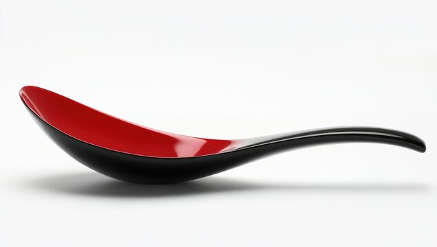 A sleek, modern black spoon with an elongated red bowl that is slightly curved at the end of its handle.