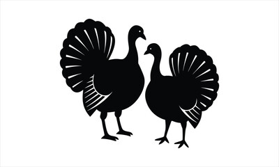 Obraz premium Two turkey silhouettes with fanned tails.