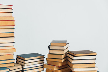 Stacks of old educational books on a white background of a school library