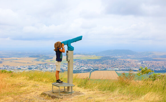 child looking at telescope panoramic landscape view