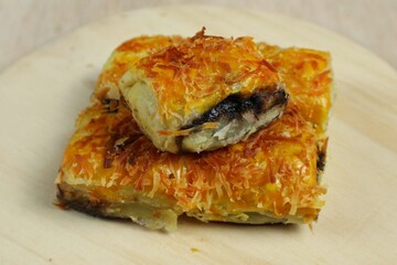 Banana Bolen Wrapped in Puff Pastry is a typical Indonesian baked bread cake with baked flour with margarine filled with chocolate and banana.