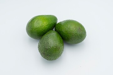 Fresh ripe green avocado on white background