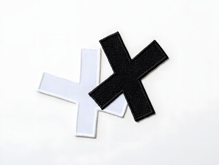 Obraz premium Minimalist Black and White Letter X Embroidered Patch Mockup