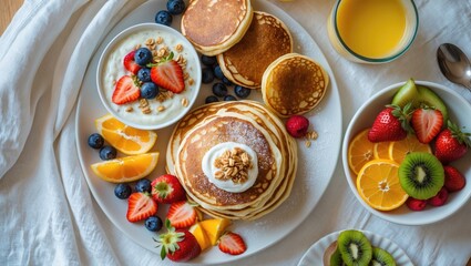 Brunch spread featuring pancakes, blinis, tropical citrus fruits, and yogurt chia pudding. Aerial view of nutritious and diet-friendly meals.