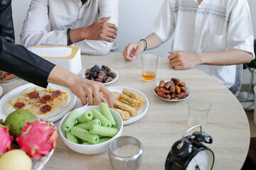 People Enjoying Various Food Served on The Dining Table During Ramadan Kareem