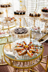 Delicious macarons and pastries decorating a luxurious candy bar buffet