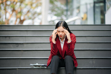 Fototapeta premium Young Asian business woman leader entrepreneur, professional manager holding digital tablet computer on the street