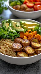 Healthy quinoa bowl with roasted potatoes, avocado, and vegetables