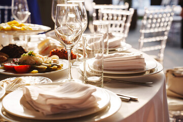 Elegant table setup with fine dining and decorative elements outdoors