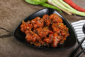 Manchurian chicken with sauce and spices