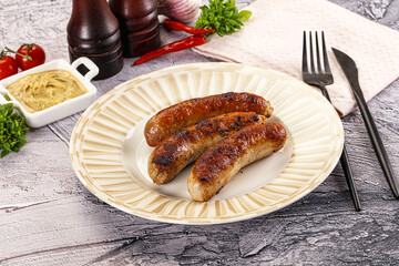 Delicous natural roasted sausages in the plate