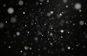 Isolated falling snow overlay on night sky. Defocused blurred snowflakes bokeh design. White snowstorm glitter particles, winter holiday festive decoration on dark black wallpaper background.