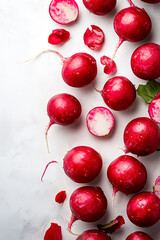 Bright and inviting whole red radishes display their vibrant red skins alongside clean edges
