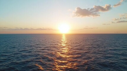 Obraz premium Beautiful Sunset Over Calm Ocean Waters with Gentle Waves