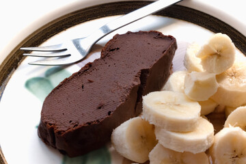 Skyr and chocolate cake, gluten free recipe with banana pieces, healthy food