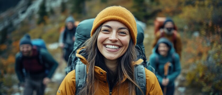 Smiling Caucasian woman with backpack hiking with friends in the mountains Concept of outdoor adventure, healthy lifestyle, and friendship - Powered by Adobe