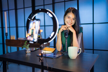 Content creator Young asian woman influencer creating content in home studio entertainment and...