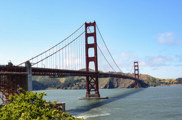 Beautiful view of famous Golden Gate Bridge with blue sky and clouds on a sunny day in summer San Francisco Bay Area California USA